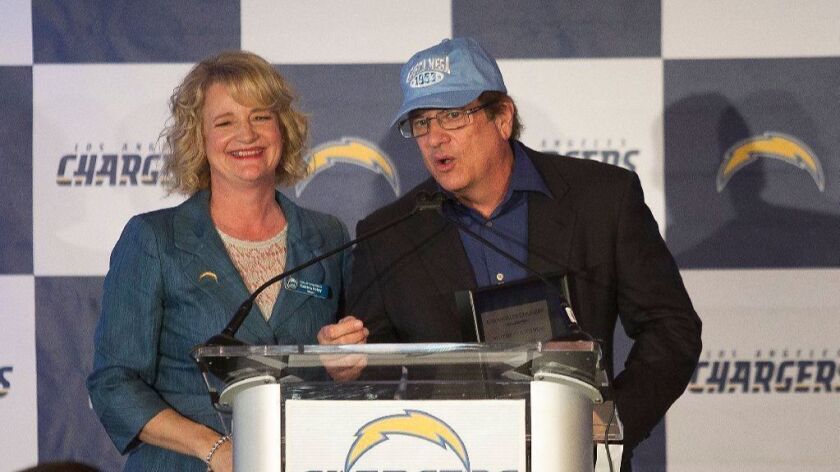 Los Angeles Chargers owner Dean Spanos is given the key to the city by Mayor Katrina Foley during a luncheon to welcome the Los Angeles Chargers to the city of Costa Mesa last year.