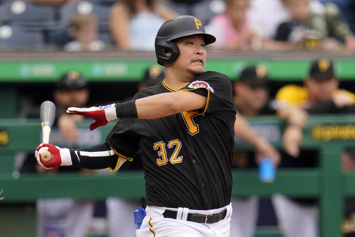 FILE - Pittsburgh Pirates' Yoshi Tsutsugo bats during the tema's baseball game against the Cincinnati Reds in Pittsburgh on Sept. 16, 2021. The Pirates are bringing back Tsutsugo. A person with direct knowledge of the deal tells The Associated Press that Pittsburgh has agreed to terms with Tsutsugo on a $4 million, 1-year deal. The person spoke to the AP on condition of anonymity Wednesday night, Nov. 24, because it had not been formally announced. (AP Photo/Gene J. Puskar, File)