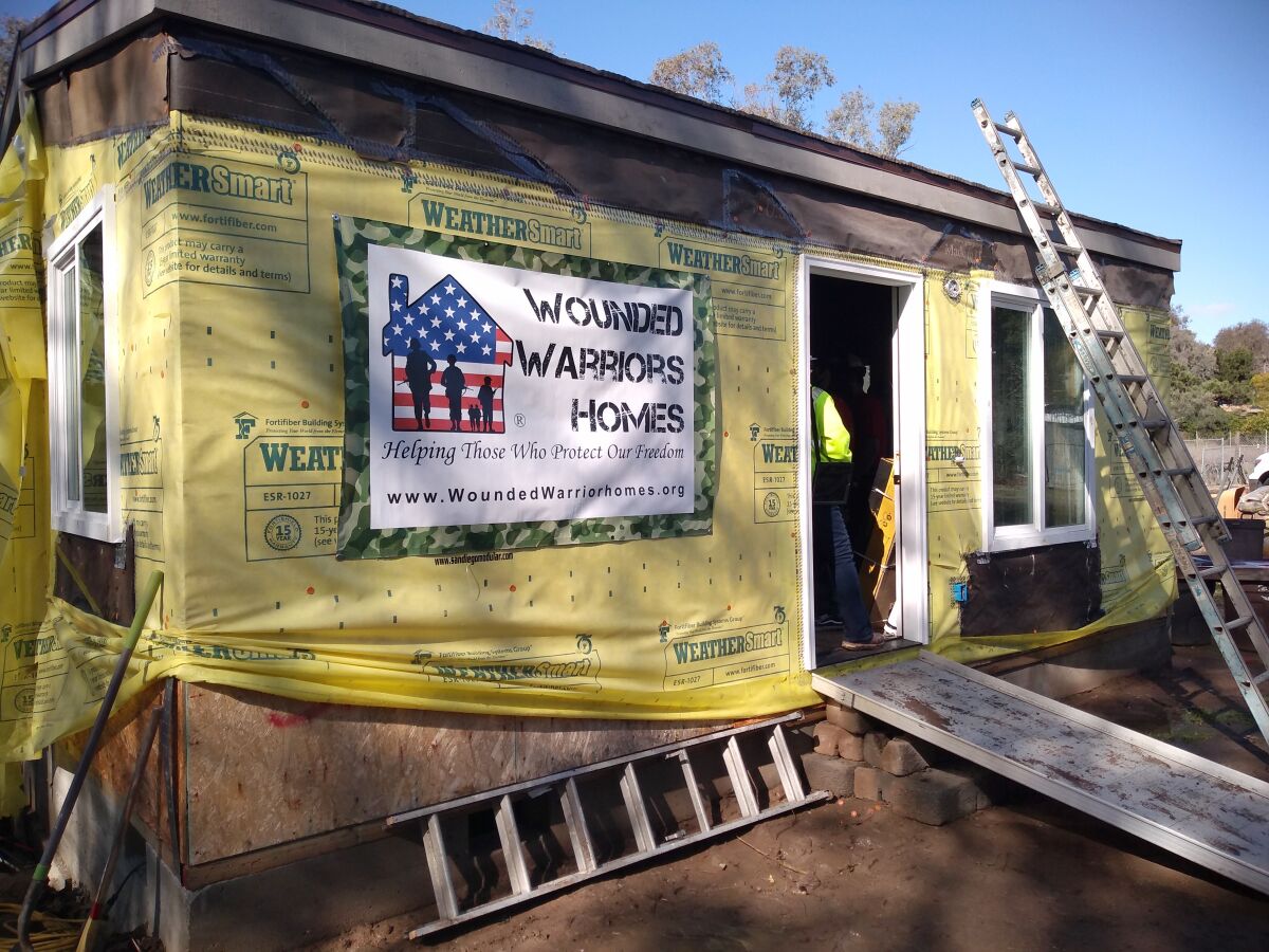 Montecito High students volunteered to add siding and other finishing touches to the new Wounded Warrior Homes cottage.