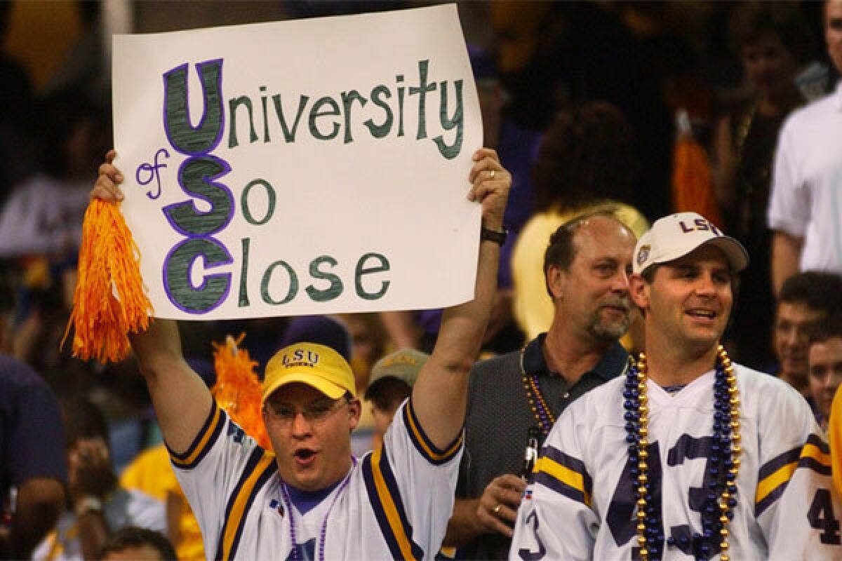 An LSU fan holds a sign taunting USC prior to the BCS title game between the Tigers and Oklahoma following the 2003 season. USC was voted No. 1 in the regular season's final coaches and AP polls, but LSU won the BCS championship.
