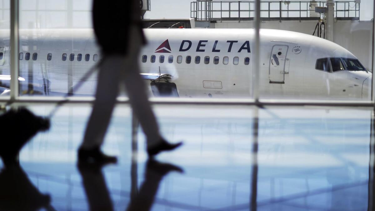 A Delta Air Lines jet sits at a gate at Hartsfield-Jackson Atlanta International Airport in October 2016.