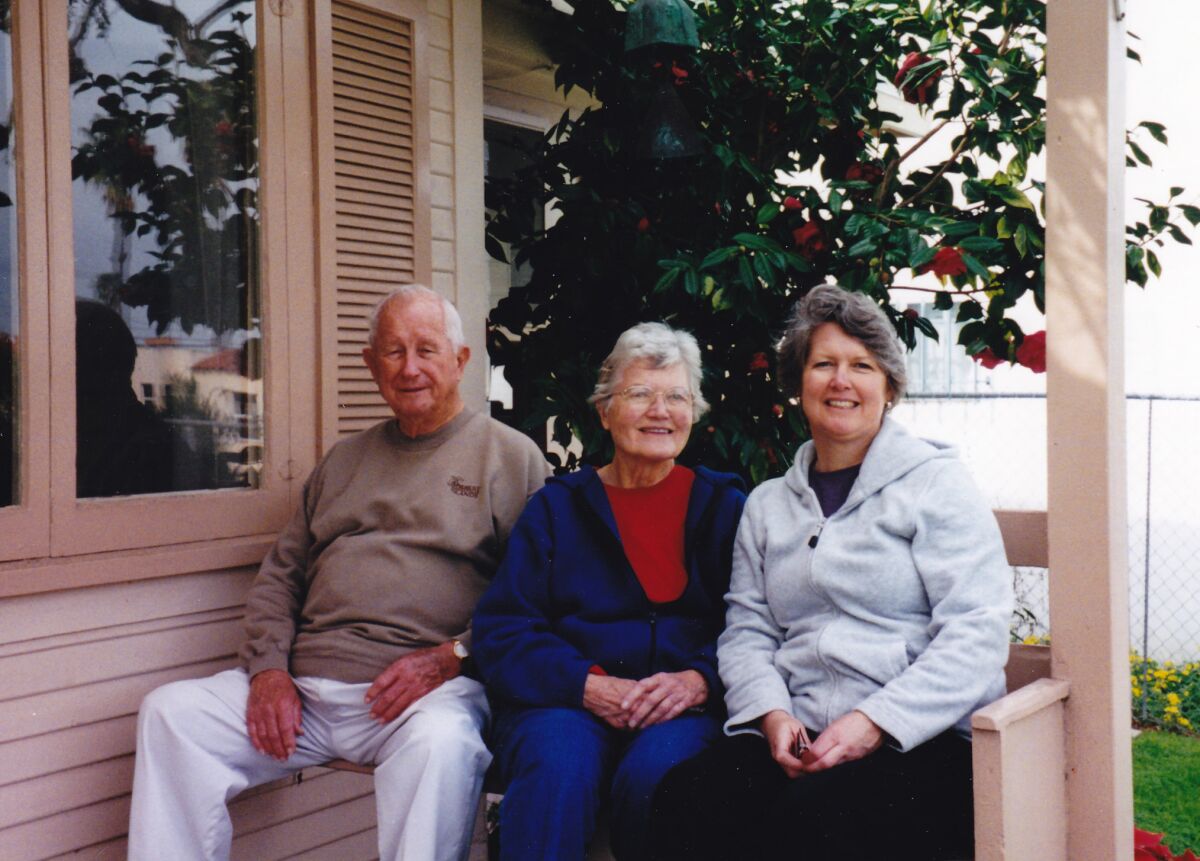 Ned, Shirley and Gail Titlow sit on the porch of Wisteria Cottage in the mid-1990s.