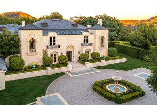 Built in 1992, the French Normandy-style mansion sits on nearly three acres with a tennis court, rose garden and 70-foot-long swimming pool.