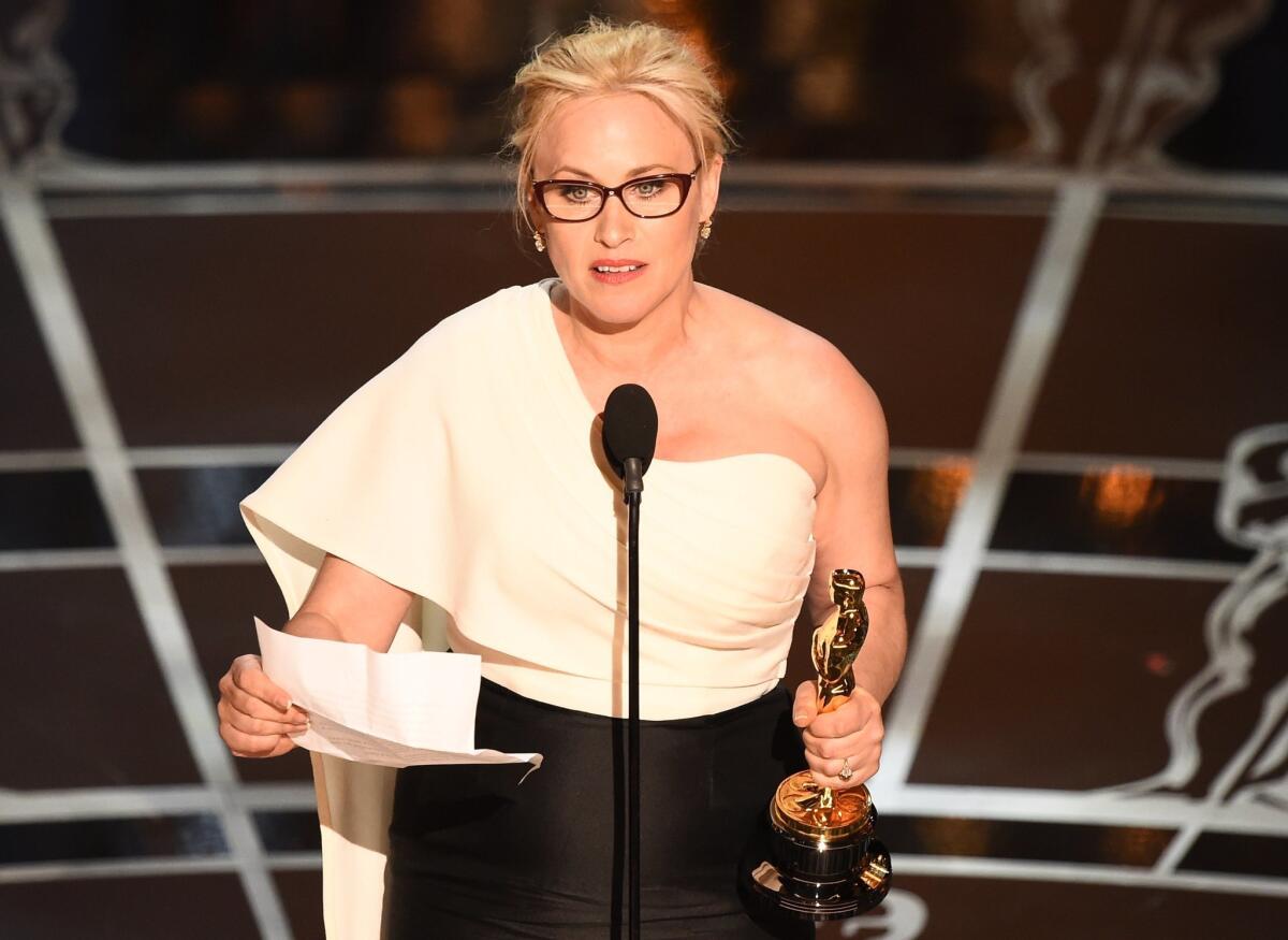 Winner for Best Supporting Actress Patricia Arquette accepts her award on stage at the 87th Oscars on Sunday in Hollywood.