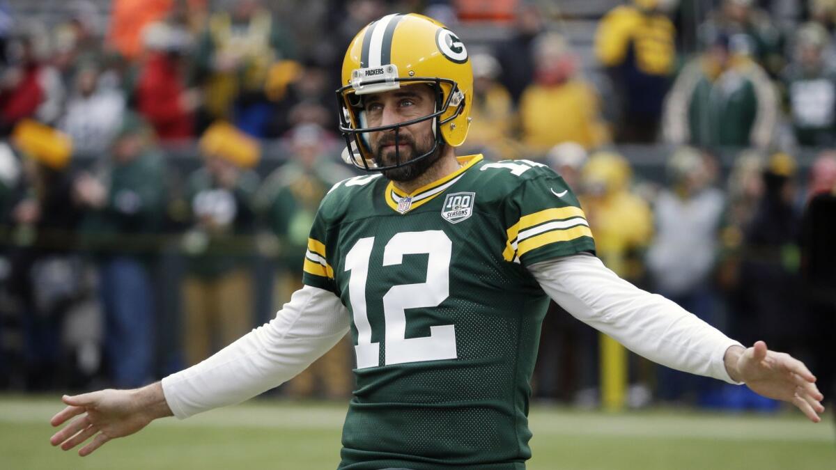 Packers quarterback Aaron Rodgers warms up before a game against the Detroit Lions on Dec. 30 in Green Bay, Wis.