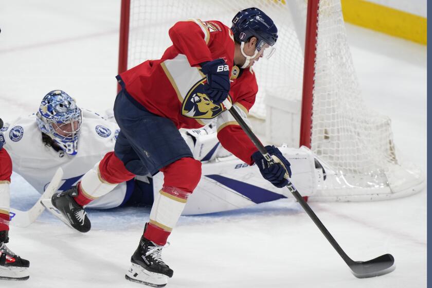 Florida Panthers center Carter Verhaeghe (23) scores against Tampa Bay Lightning goaltender Andrei Vasilevskiy (88) during an overtime period of Game 2 of the first-round of an NHL Stanley Cup Playoff series, Tuesday, April 23, 2024, in Sunrise, Fla. The Panthers beat the Lightning 3-2 in overtime. (AP Photo/Wilfredo Lee)
