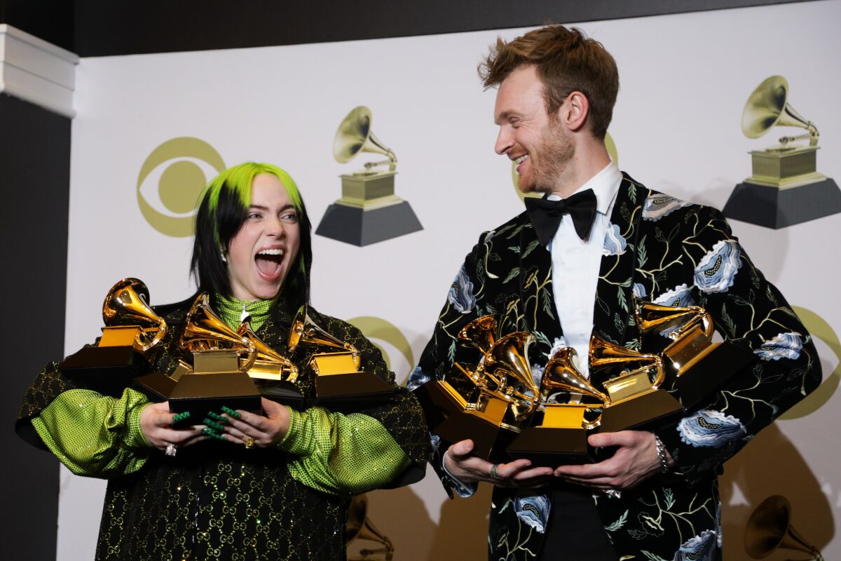 Billie Eilish and Finneas O'Connell with their Grammys