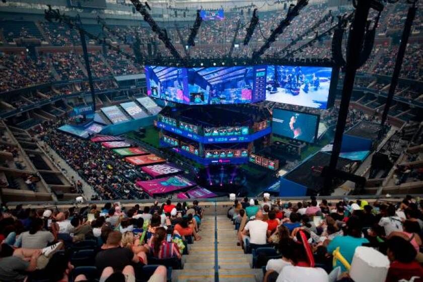 Fans follow the final of the Solo competition at the 2019 Fortnite World Cup July 28, 2019 inside of Arthur Ashe Stadium, in New York City. (Photo by Johannes EISELE / AFP) (Photo credit should read JOHANNES EISELE/AFP/Getty Images)