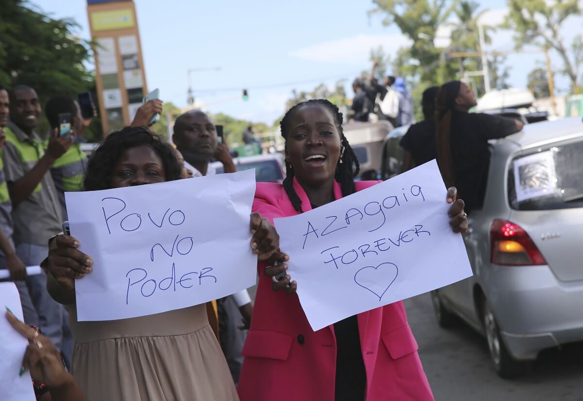 Protesters take part in a march supporting rapper Azagaia in Maputo, Mozambique, Wednesday, March 15, 2023. Mozambicans are planning marches across the country to honor Azagaia, whose real name was Edson da Luz, a popular protest rapper and fierce government critic who died last week. (AP Photo/Tom Gauld)