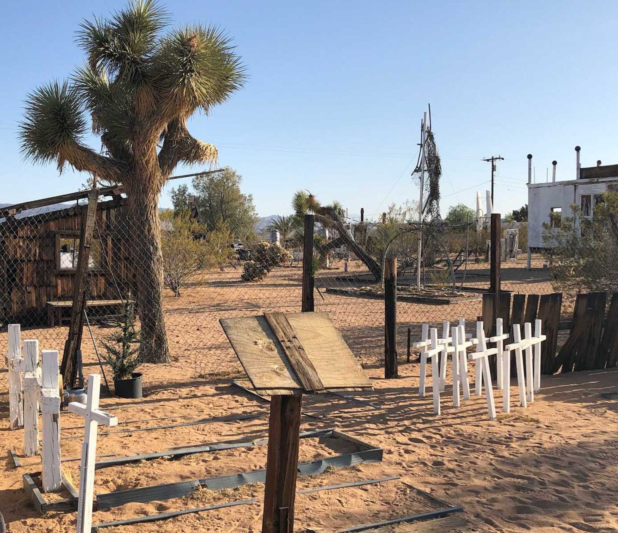 White crosses and other art installations in the desert