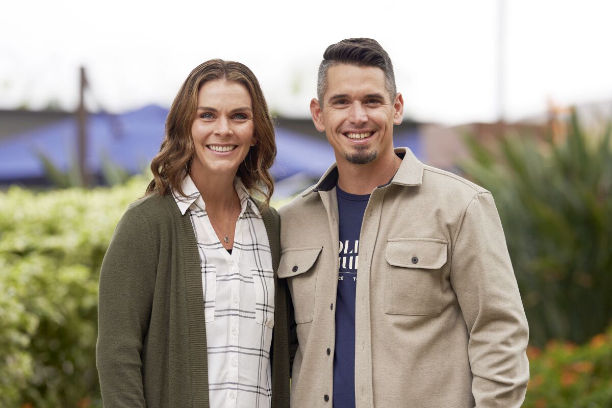 Pastor Andy Wood and his wife, Stacie Wood, stand for a portrait