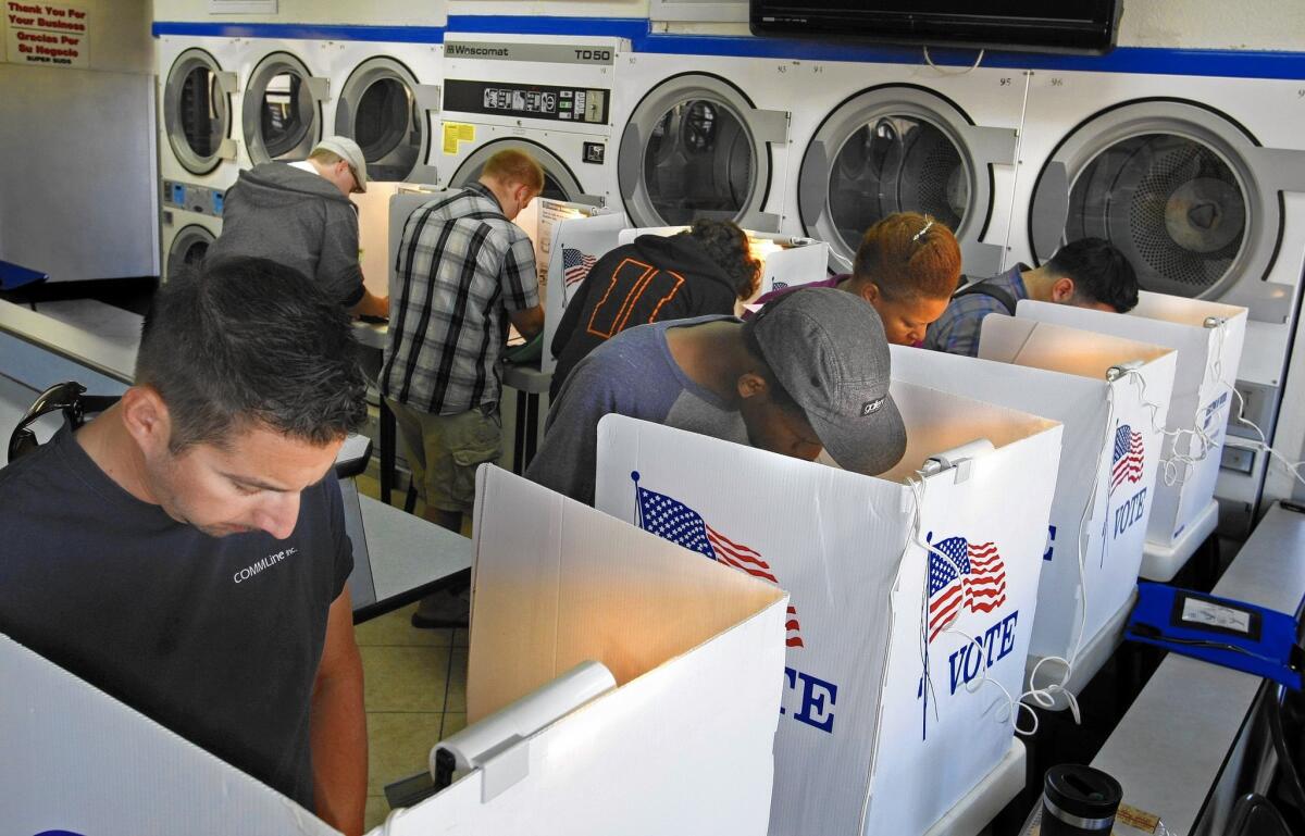 More than 600,000 Californians have registered to vote online or updated their registration in just the last three months. Above, voters cast ballots at a Long Beach laundromat in November 2012.