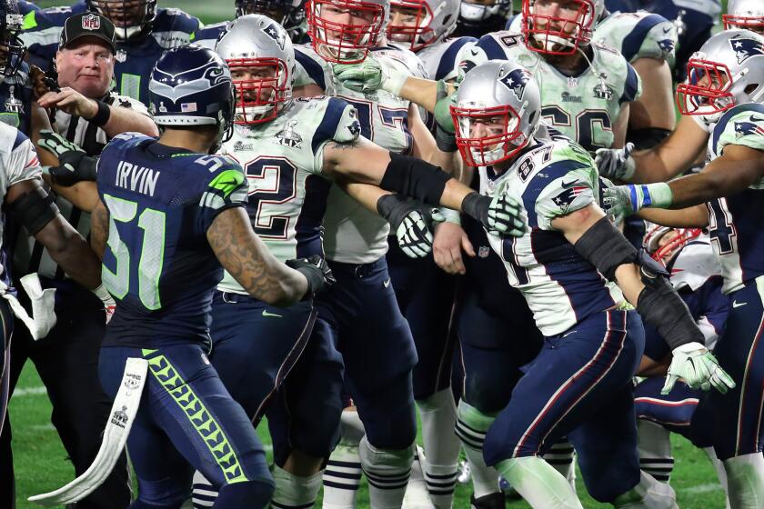 Seahawks linebacker Bruce Irvin (51) and Patriots tight end Rob Gronkowski are separated after a skirmish broke out in the final seconds of Super Bowl XLIX.