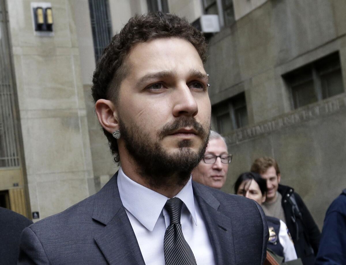 FILE - In this March 20, 2015 file photo, actor Shia LaBeouf is escorted by court officers as he leaves Manhattan Criminal court in New York. LaBeouf has received stitches to his head and hand after suffering an injury on the North Dakota set of the film "American Honey." A publicist for LaBeouf said on Wednesday, June 24, the actor's injuries were "minimal." The accident occurred Tuesday evening for a scene in which the actor was to put his head through a glass window. LaBeouf was treated at a local hospital for a laceration to his head and hand. He's to return to shooting Thursday. (AP Photo/Mary Altaffer, File )