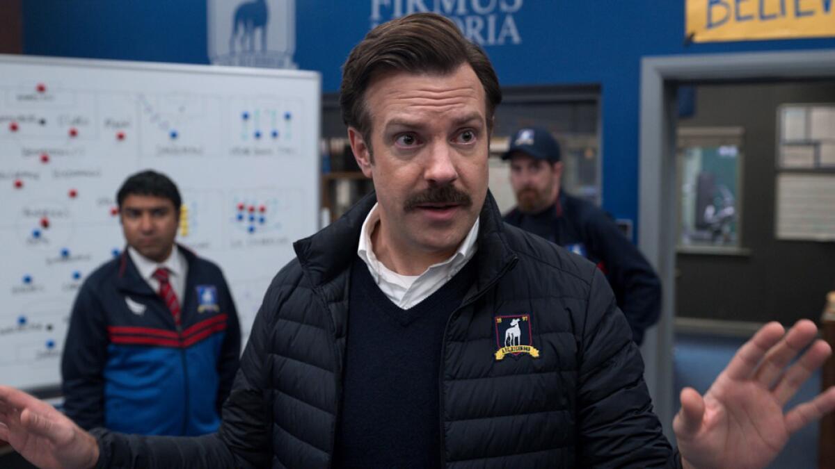 Jason Sudeikis speaks to a team in his role as a soccer coach in "Ted Lasso."