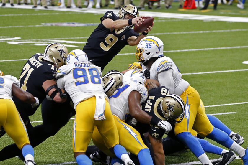 New Orleans Saints quarterback Drew Brees (9) dives over the goal line for a touchdown.