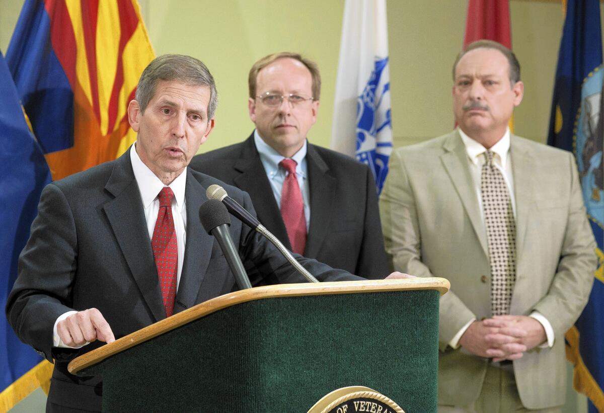 Acting Veterans Affairs Secretary Of Sloan Gibson, left, holds a news conference at the Phoenix VA medical center.