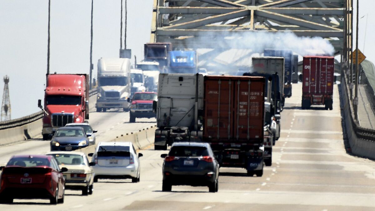 The Los Angeles and Long Beach port complex will seek to slash air pollution and health risks to Southern Californians by replacing diesel trucks and cargo equipment with zero-emissions technology over the next two decades.
