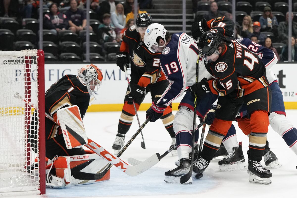 Ducks goalie Lukas Dostal, who had 38 saves, makes a stop against the Blue Jackets' Liam Foudy (19) during the second period.