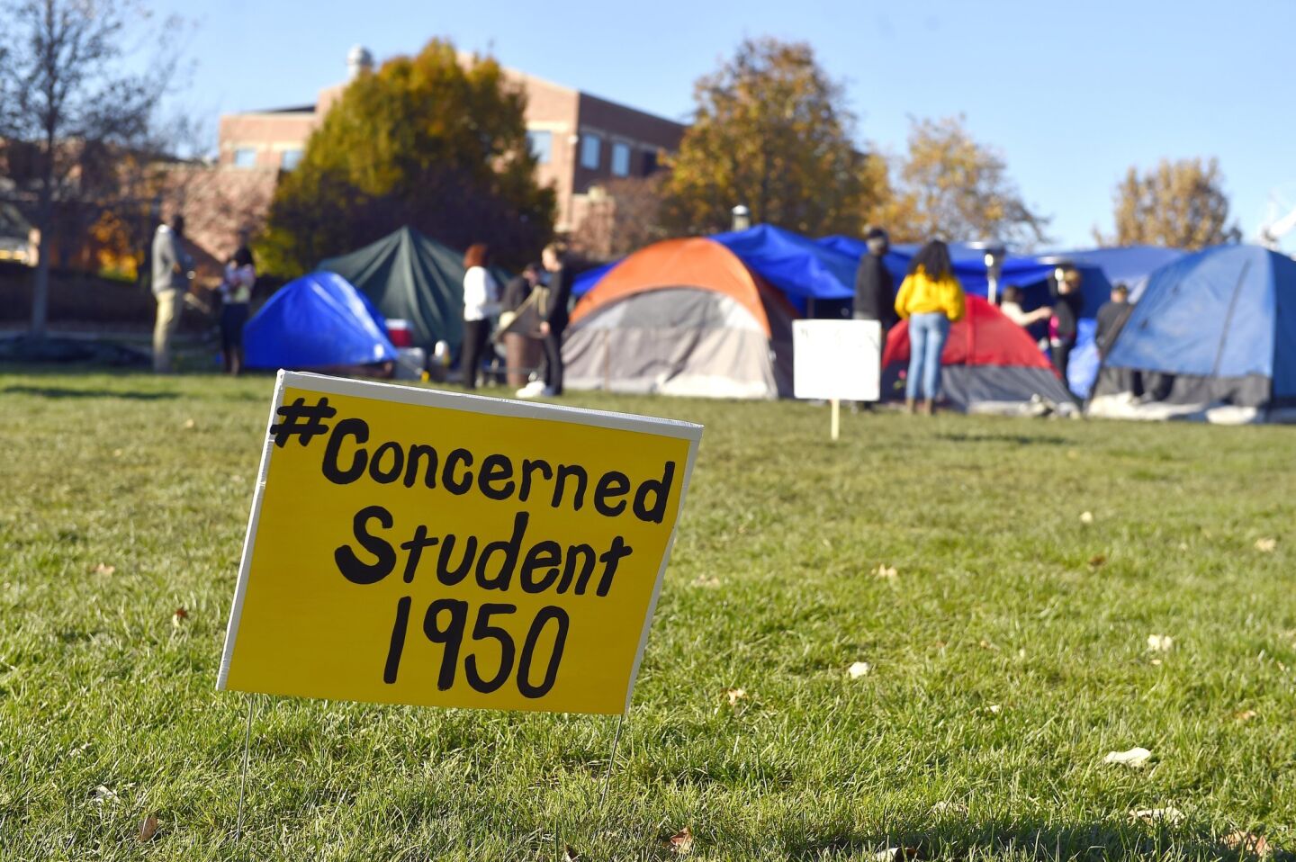 A sign is posted where student protesters have put up tents on the University of Missouri campus Sunday in Columbia, Mo.