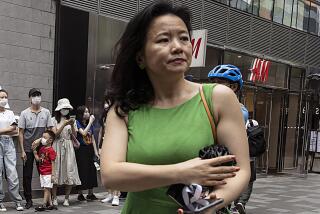 FILE - Cheng Lei, a Chinese-born Australian journalist for CGTN, the English-language channel of China Central Television, attends a public event in Beijing on Aug. 12, 2020. Cheng who worked for China’s state broadcaster and was convicted on murky espionage charges during her three years in detention in China had been returned to Australia, Prime Minister Anthony Albanes said on Wednesday, Oct. 11, 2023. (AP Photo/Ng Han Guan, File)