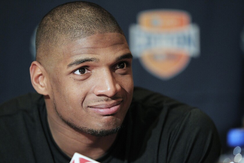 Michael Sam, seen in January, was selected by the St. Louis Rams on Sunday in the seventh and final round of the NFL draft.