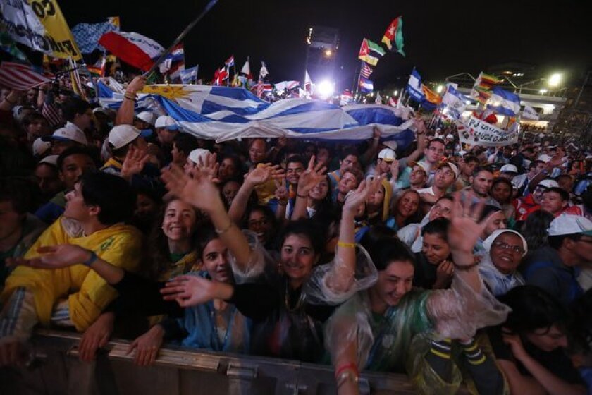 Thousands of young people gather Tuesday on Copacabana Beach for a World Youth Day Mass in Rio de Janeiro.