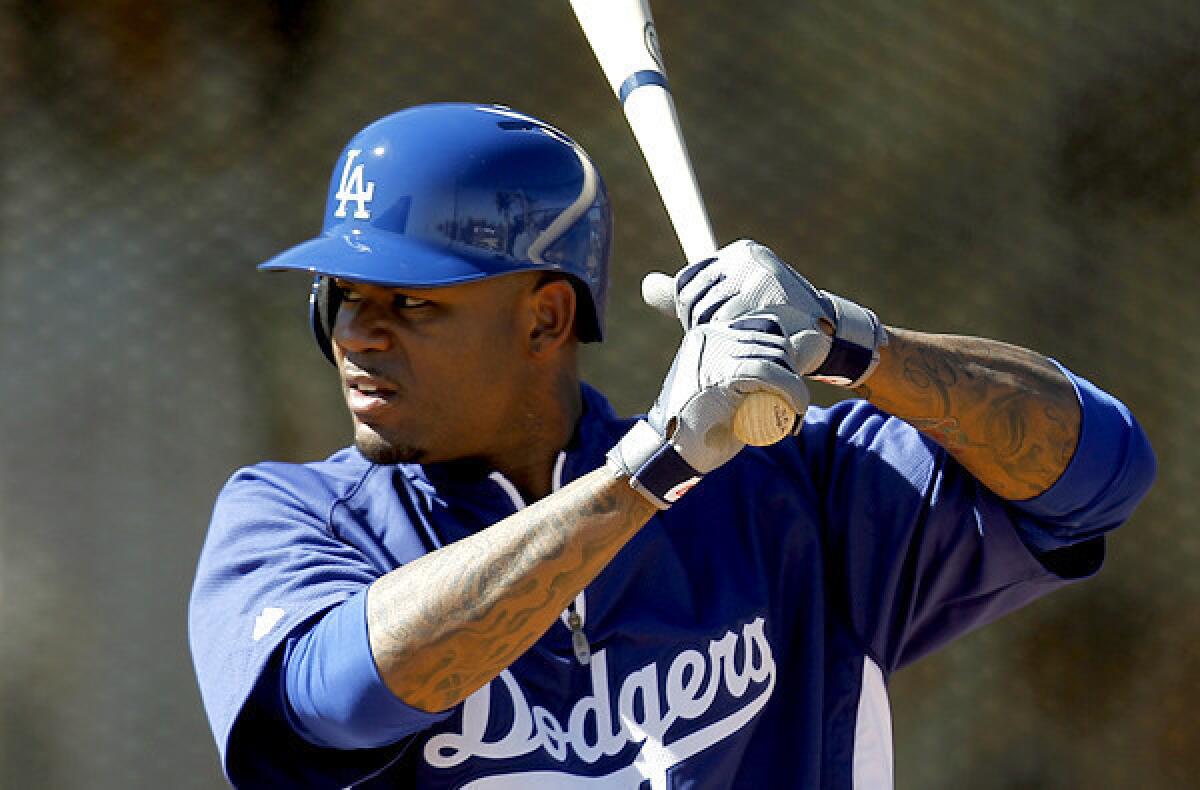 Dodgers left fielder Carl Crawford works on his swing during spring training.
