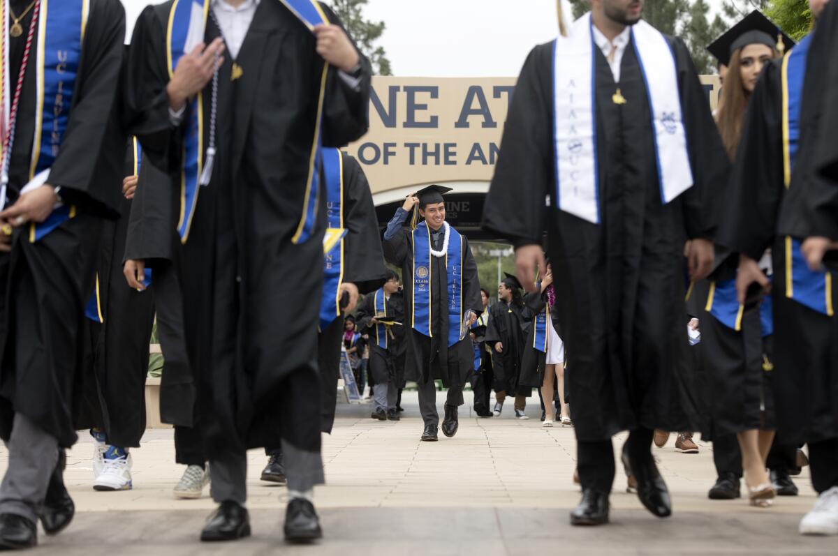 Graduates from the Henry Samueli School of Engineering walk.