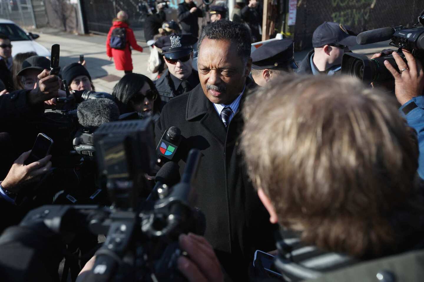 The Rev. Jesse Jackson talks to reporters before Whitney Houston's funeral.