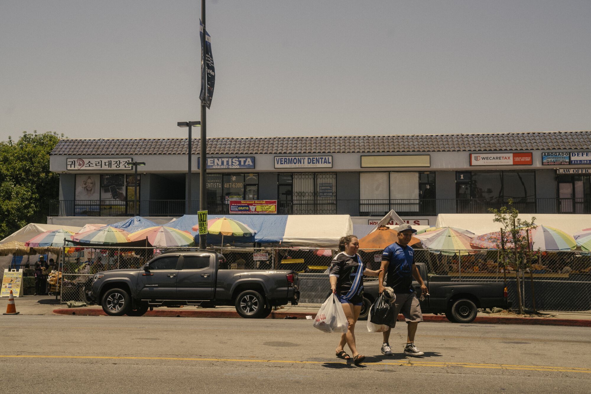 Fencing was placed along the sidewalk in front of the Salvadoran street food market.