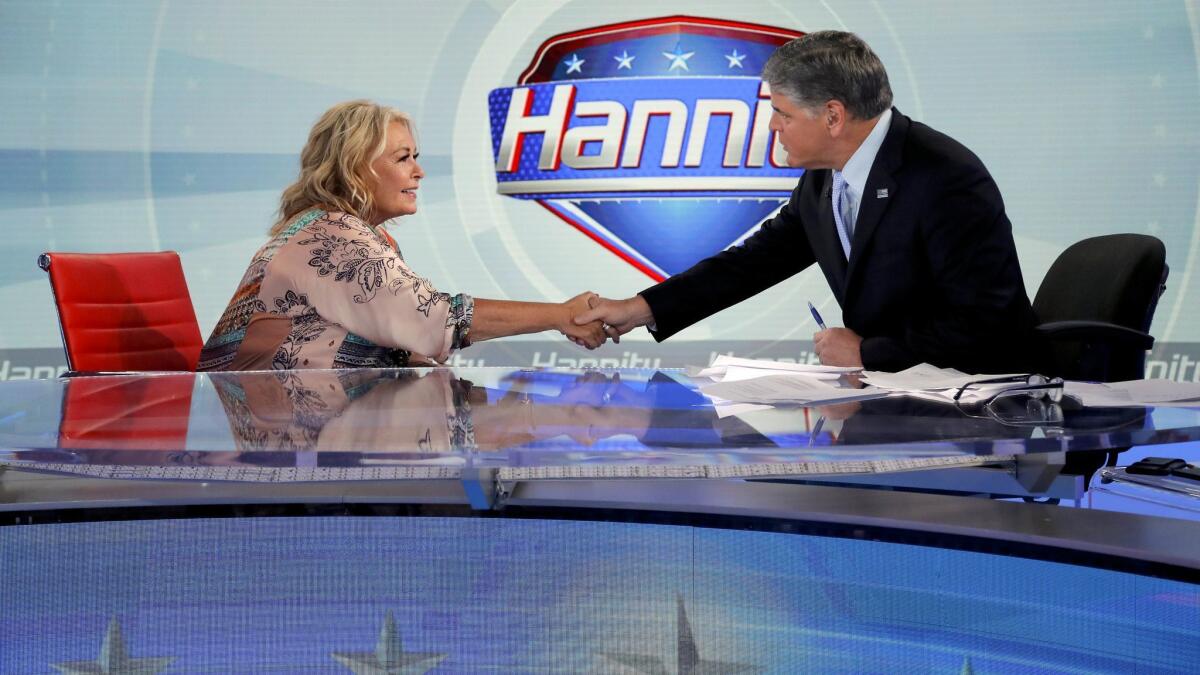 Roseanne Barr greets Fox News host Sean Hannity.