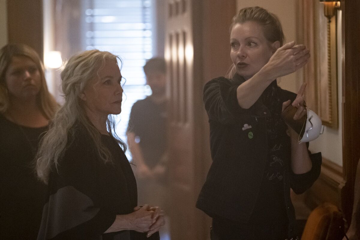 Axelle Carolyn gestures while directing Barbara Hershey in "The Manor."