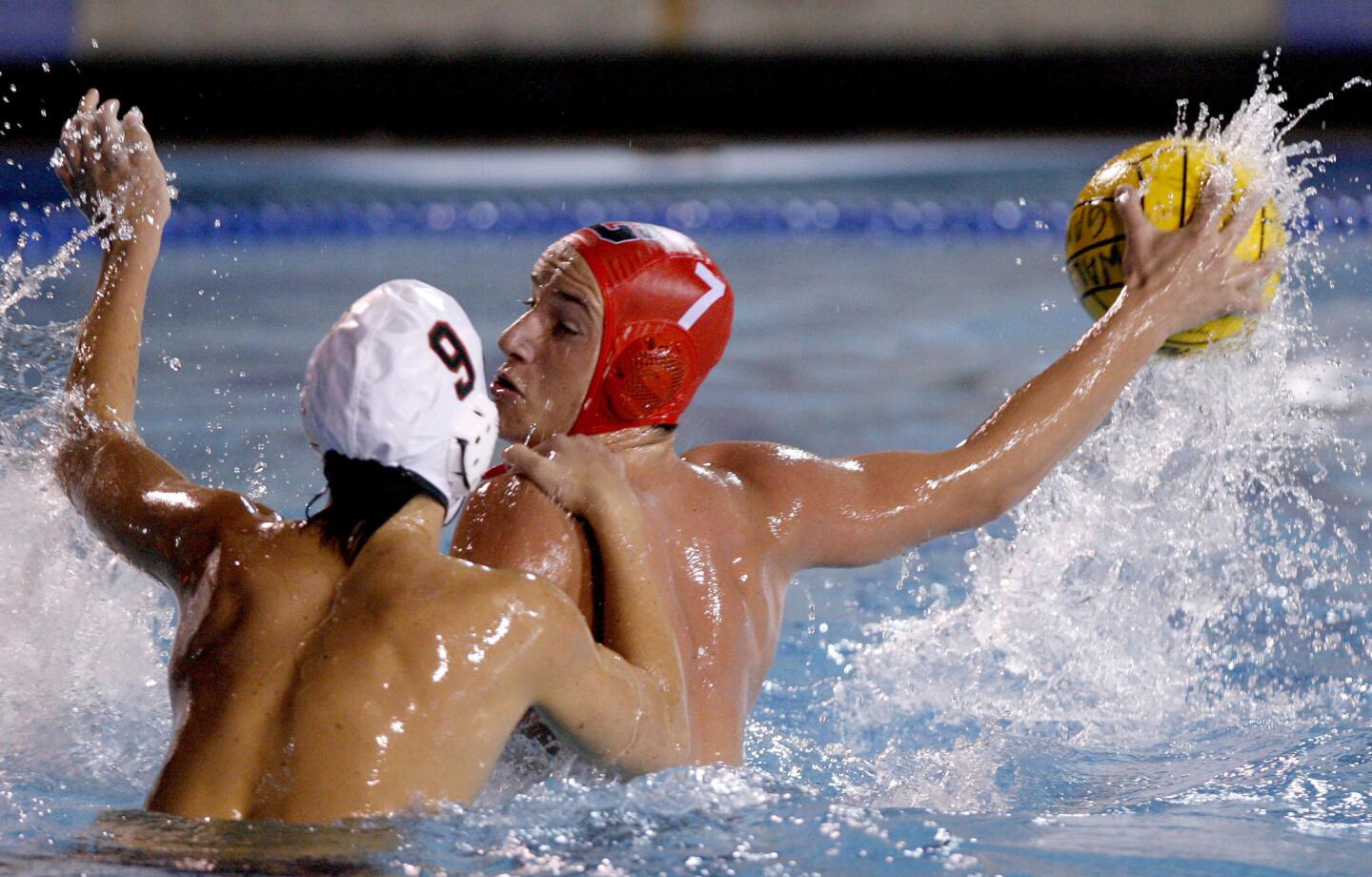 Glendale High's #7 Manuk Piloyan takes a shot on goal under pressure from #9 Jackson Sawa during 2012 CIF SS Div. 5 Boys Water Polo Semi Finals vs. Riverside Poly at Mt. San Antonio College in Walnut on Wednesday, Nov. 14, 2012. Glendale won 14-7 and will play Pasadena Poly in the finals.