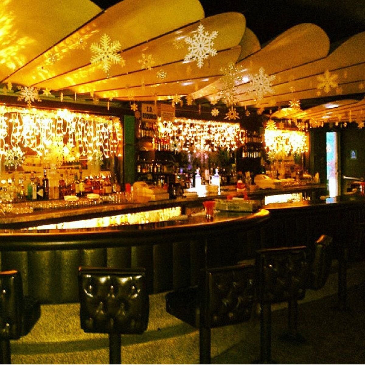 The clamshell design over the bar is part of the oceanic theme at Pacific Shores Cocktail Lounge in Ocean Beach.