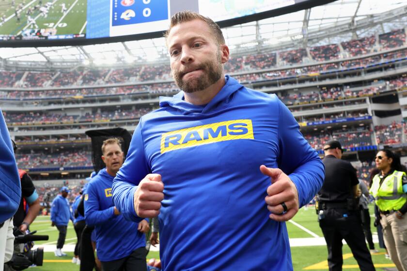 Rams coach Sean McVay jogs toward the locker room at SoFi Stadium. 