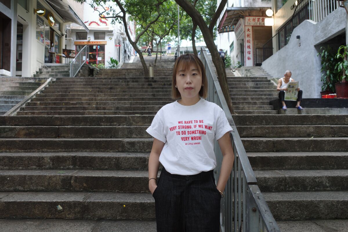 Hong Kong filmmaker Mok Kwan Ling in a T-shirt that says, "We have to be very strong if we want to do something very wrong."
