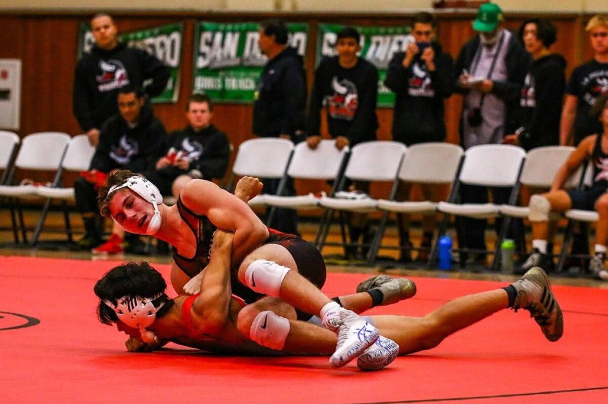 La Jolla High School senior Caden Kestler pins an opponent during a recent wrestling match.