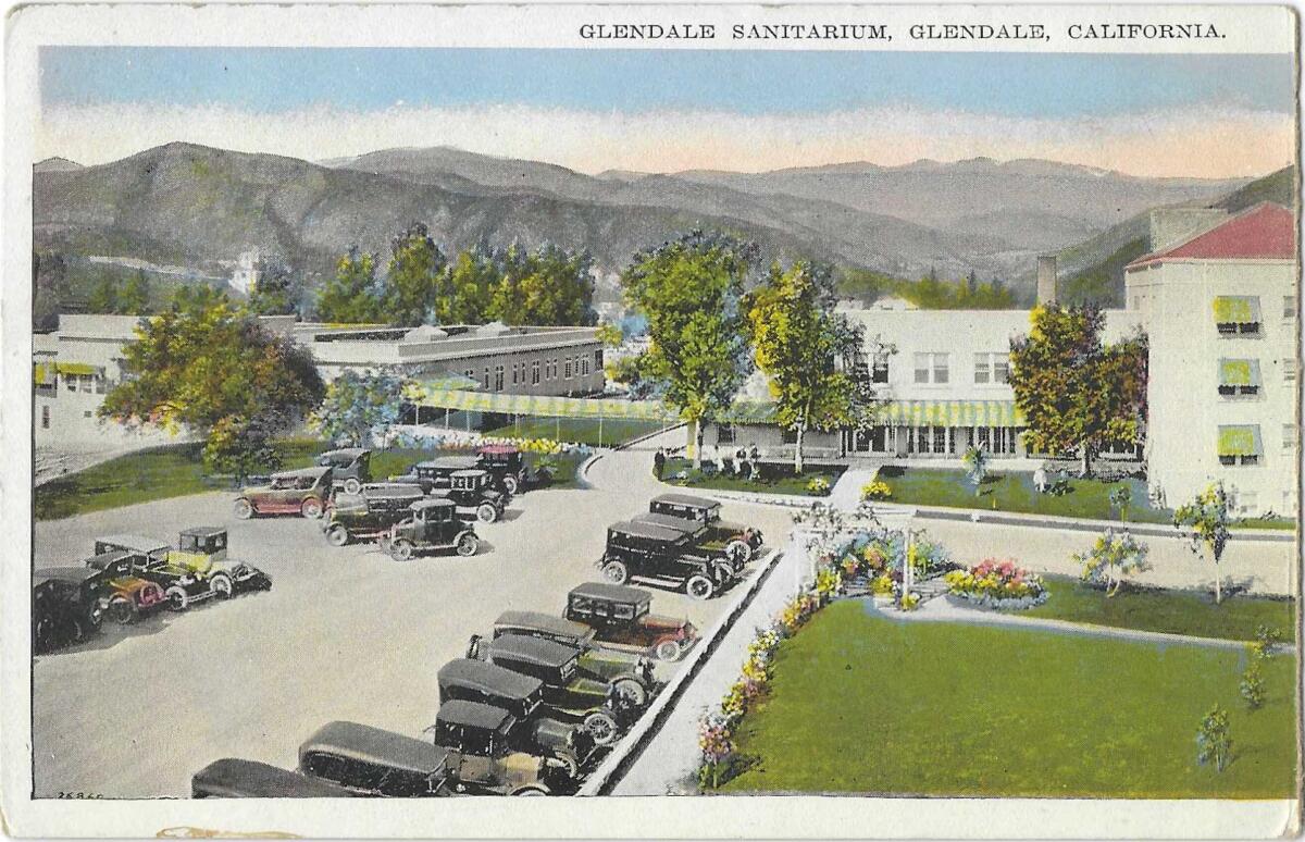 Pre-WWII cars are seen in the parking lot of the Glendale Sanitarium