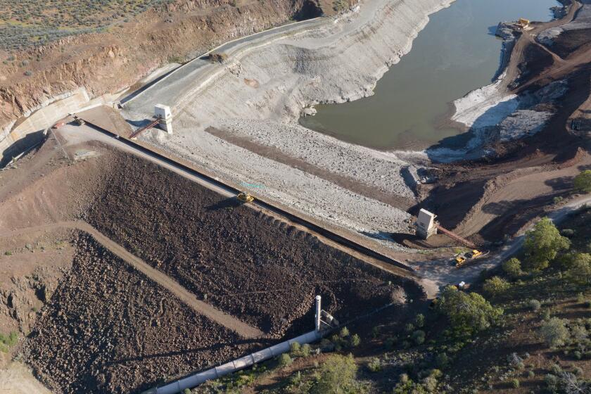 Work is started on dismantling the Iron Gate Dam, the largest dam on the Klamath river.
