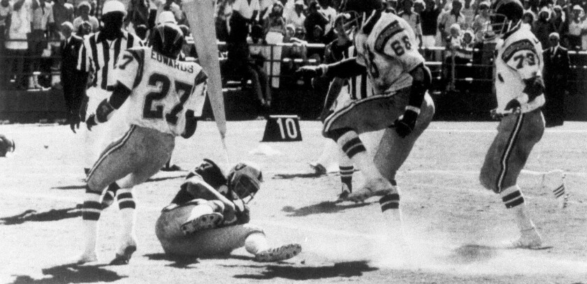 In this Sept. 11, 1978, file photo, Oakland Raiders' Dave Casper falls in the end zone for a touchdown against the Chargers.