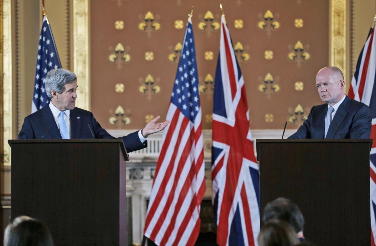 Secretary of State John Kerry, left, and British Foreign Secretary William Hague hold a joint news conference after a meeting Monday in London.
