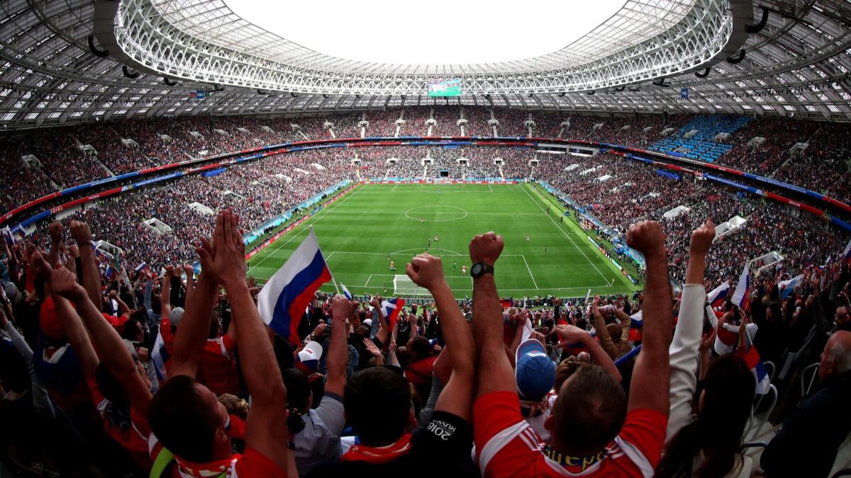 Russian fans celebrate Iury Gazinsky's opening goal in the 2018 FIFA World Cup Russia Group A match between Russia and Saudi Arabia on June 14, 2018, in Moscow.