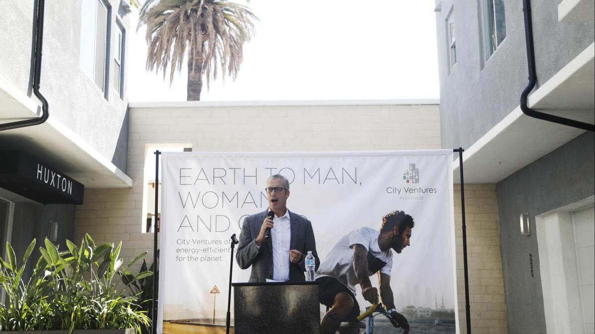 City Ventures CEO Phil Kerr speaks during the grand opening of the Huxton all-solar community in Long Beach.