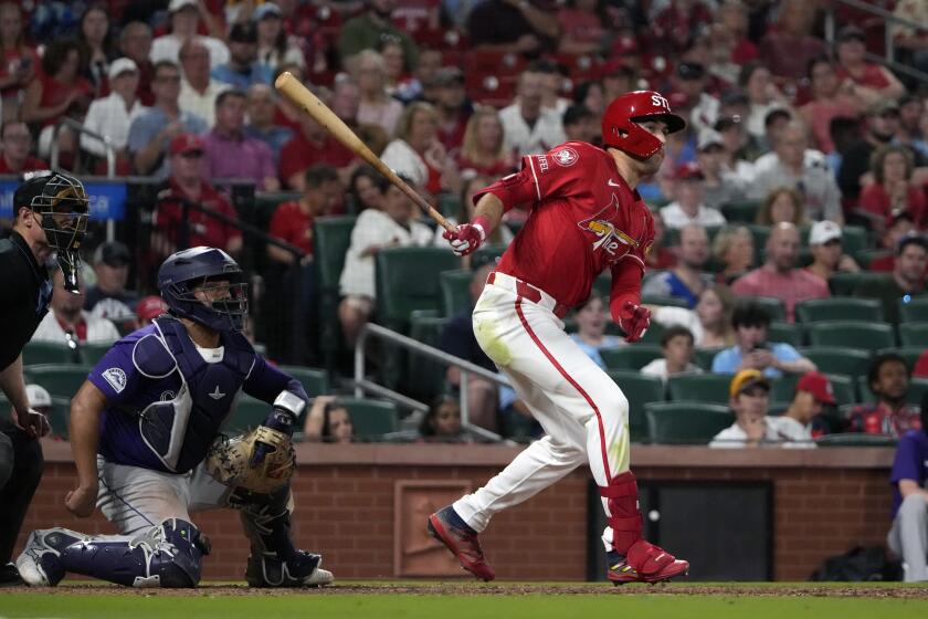 St. Louis Cardinals' Dylan Carlson follows through on a two-run double during the eighth inning of a baseball game against the Colorado Rockies Friday, June 7, 2024, in St. Louis. (AP Photo/Jeff Roberson)