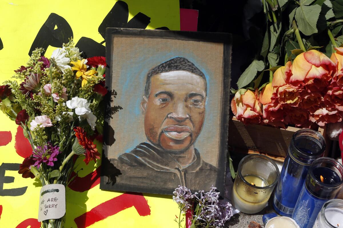 A portrait of George Floyd is displayed at a makeshift memorial for him in Minneapolis.