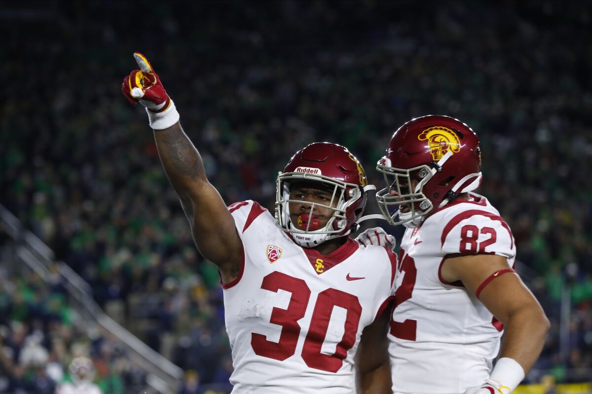USC running back Markese Stepp (30) celebrates after scoring on a two-yard touchdown run in the second half against Notre Dame in South Bend, Ind. on Saturday.