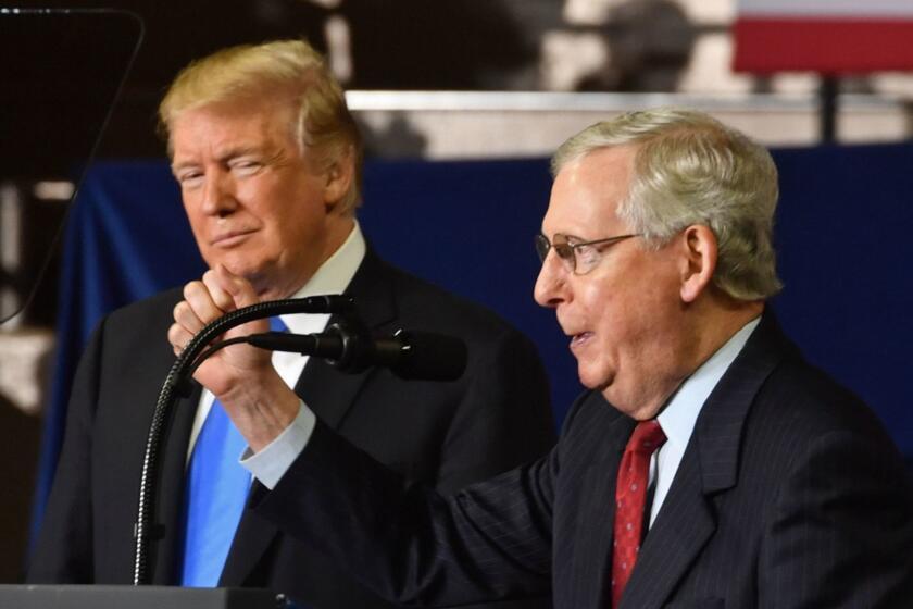 US Senate Majority Leader Mitch McConnell (R-KY) speaks as US Presidente Donald Trump looks on during a "Make America Great Again" rally at the Eastern Kentucky University, in Richmond, Kentucky, on October 13, 2018. (Photo by Nicholas Kamm / AFP)NICHOLAS KAMM/AFP/Getty Images ** OUTS - ELSENT, FPG, CM - OUTS * NM, PH, VA if sourced by CT, LA or MoD **