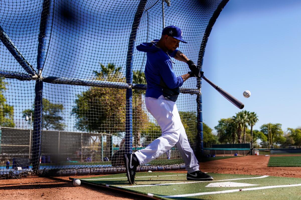 Dodgers right fielder Mookie Betts hits a pitch in batting practice.
