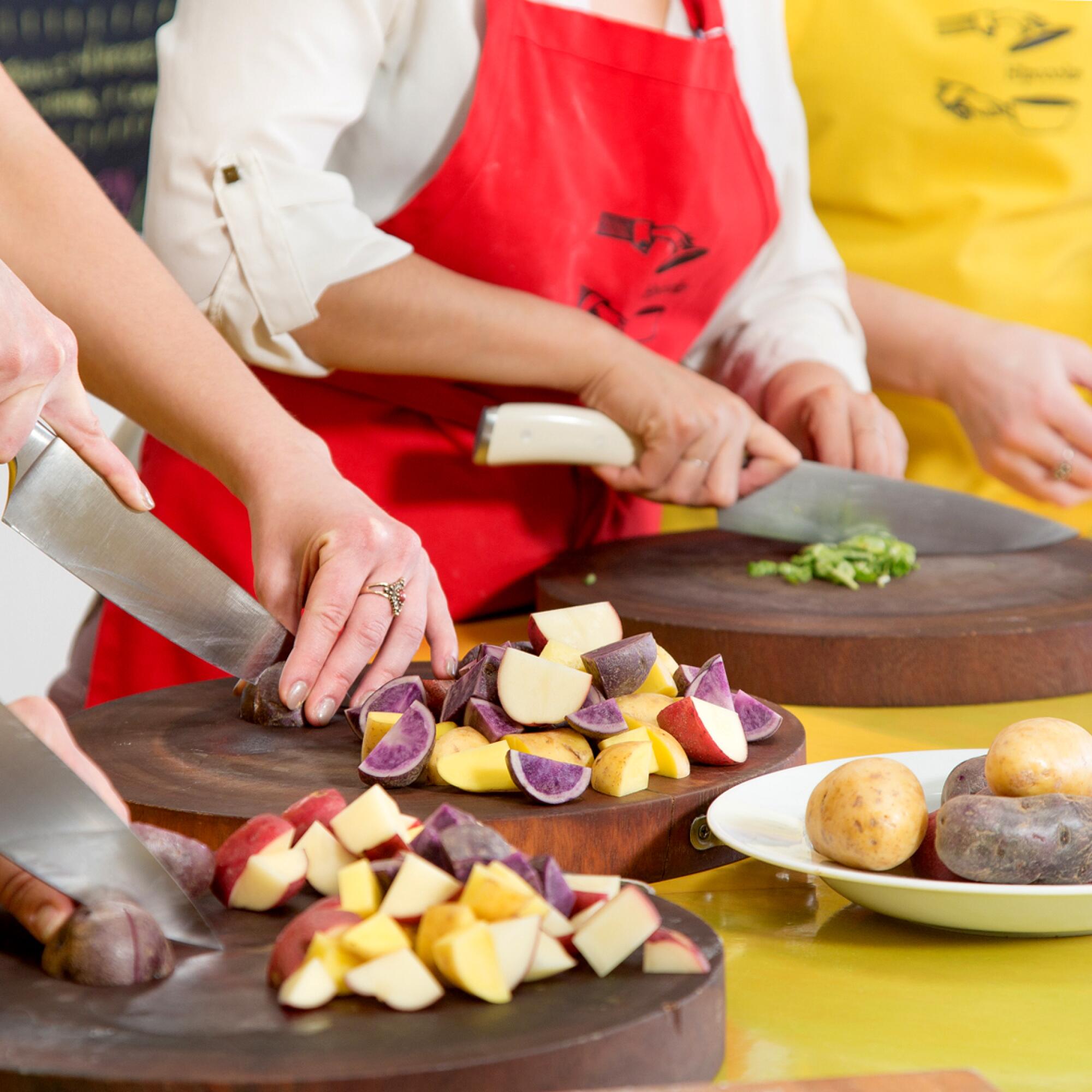 Hipcooks teachers preparing dishes.